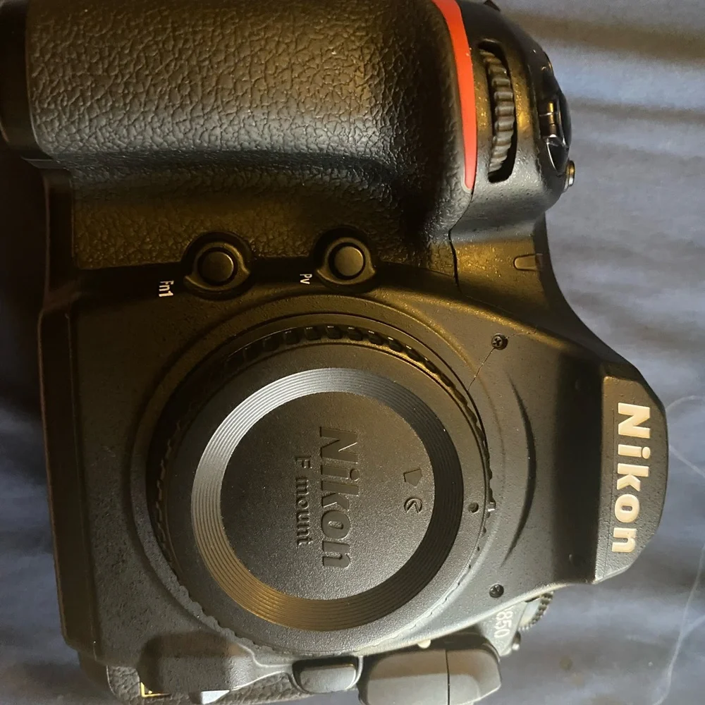 Nikon D850 digital black camera. With battery charger